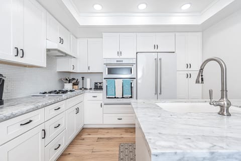 The kitchen comes stocked with dishes, utensils, cookware, bakeware, and small & large appliances.