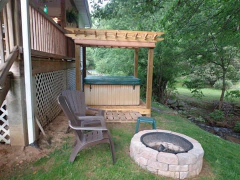 Back yard with hot tub and creek