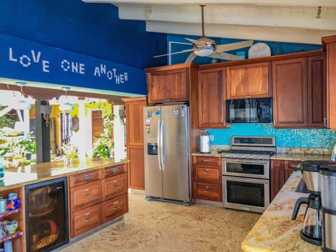 Main Kitchen - opens to courtyard on one side and ocean on the other 