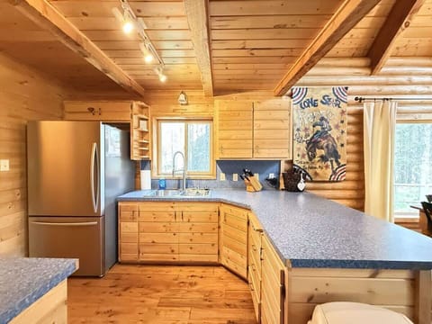 Full size kitchen with appliances, pots and pans, dishes, utensils, and basic cooking essentials.