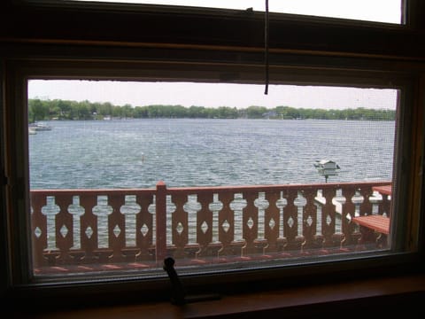 Lake view from window over kitchen sink. Picnic table on the deck.