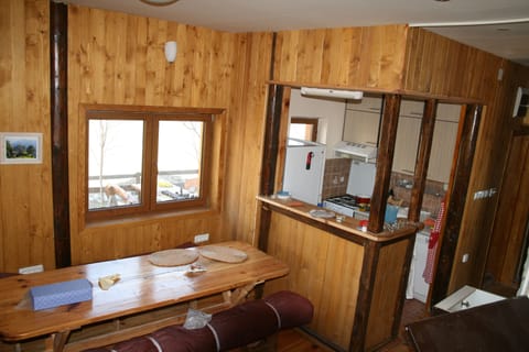 Dining table and kitchen with mountain views