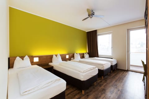 Quadruple Room | Select Comfort beds, in-room safe, desk, blackout drapes