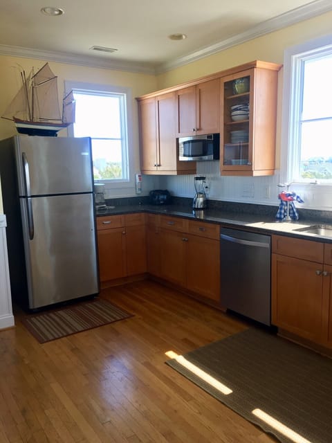 Spacious kitchen with stainless steel appliances. 
