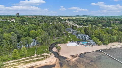 Tucked along the wooded edge of East Grand Traverse Bay, this updated ground-floor Shores condo is part of the Grand Traverse Spa & Golf Resort.