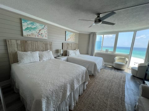 Two queen beds with blackout drapes for a restful night’s sleep