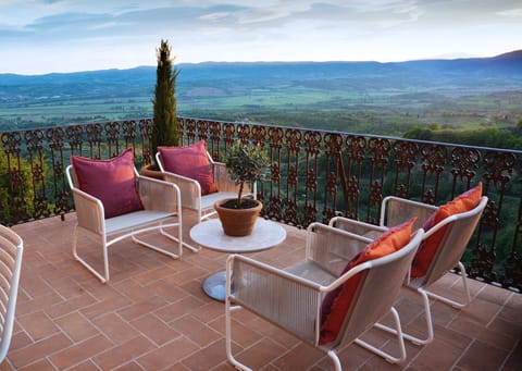 the lounge area on the terrace with view of Tuscany