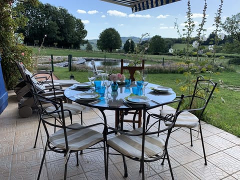 Terrace with view on the garden and the pools
