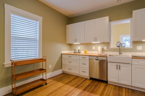 Classic "Shaker" style cabinets and farm sink .