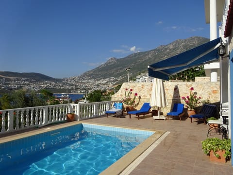 Private pool with sun shades and view into Kalkan Town