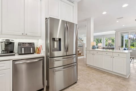 Luxury Kitchen with Stainless Steel Appliances and Stunning Quartz Countertops