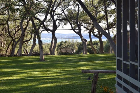 View from the master bedroom. Screened in porch on the right with same view