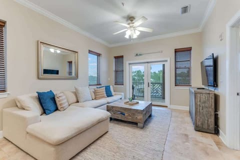 - Stretch out on the oversized sectional, ideal for family time or cozying up with a book - Soft neutral tones, blue pops, and woven textures create a breezy, relaxed vibe - Step through the French doors to enjoy your own peaceful, tree lined patio