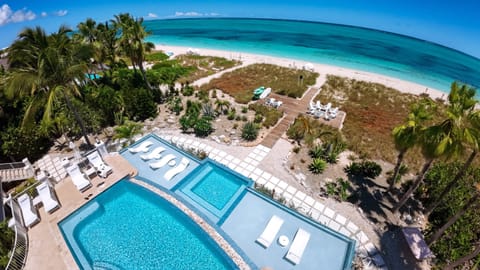 Spend the day on 8 private beachfront loungers & umbrellas