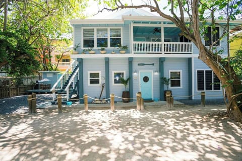 The Boat House Owners Suite on the upper level is just steps away from picturesque West Bay Beach.