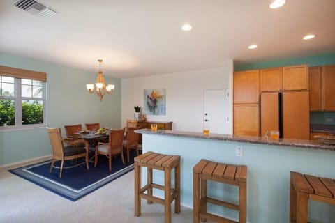 Open concept layout connects living room, dining, and kitchen