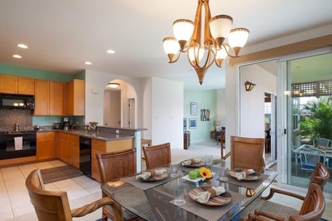 Dining area with glass top dining table and seating for six