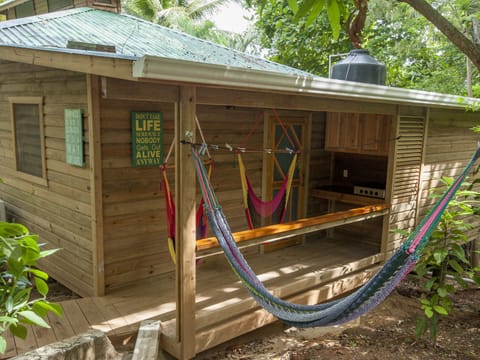 Front of Casita, hammock and hammock chairs on porch