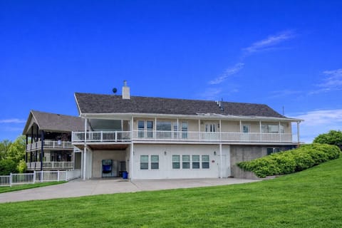 Sunny retreat with spacious deck, wide driveway, and open yard perfect for relaxing or entertaining