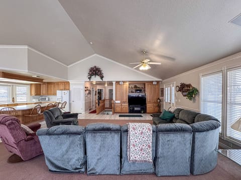 Expansive open-concept space with charm, ideal for meals, lounging, and family fun