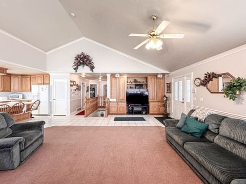 Expansive open-concept space with charm, ideal for meals, lounging, and family fun