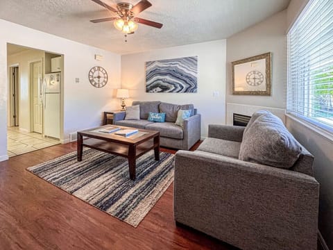 Cozy living room with modern decor, natural light, and a welcoming ambiance for relaxation.