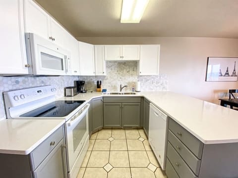 Modern kitchen with clean lines, ample counter space, and cheerful natural light for effortless cooking.