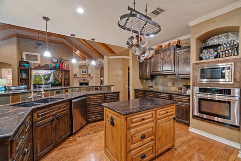 Kitchen features All Clad Pots, two ovens, microwave/airfryer