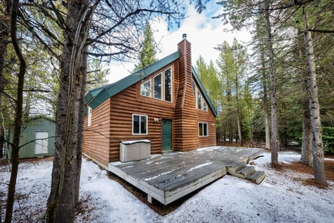 Spacious deck perfect for placing a few chairs and relaxing while taking in the surrounding forest views.