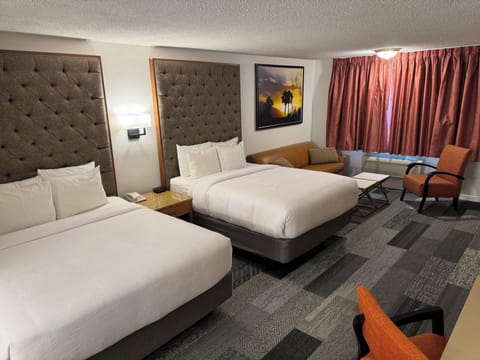 Deluxe Room, Multiple Beds, Non Smoking, Refrigerator & Microwave, No Pets | Desk, laptop workspace, soundproofing, iron/ironing board