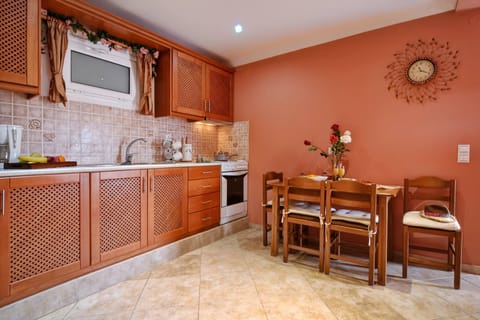 Angela Pool Apartment Agios Georgios Kitchen And Dining Area