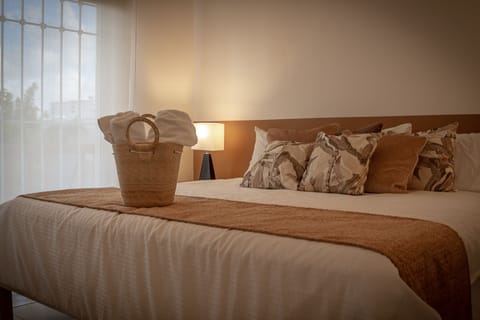 Master bedroom at Casa Pakal features a comfortable king size bed and terrace.