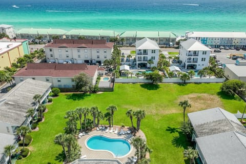An aerial view of the beachside Summerhouse community and its pools.