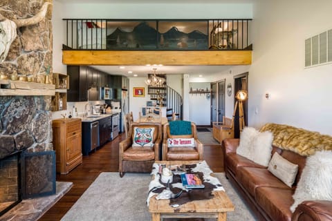 Living area, looking towards kitchen and upstairs loft