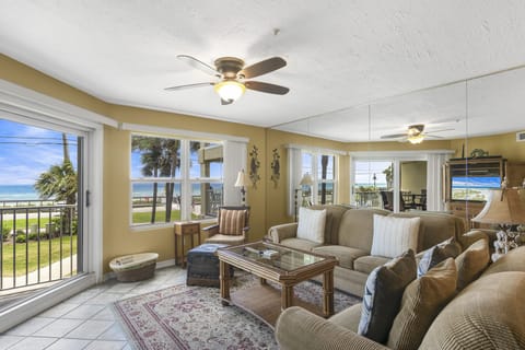 Sink into the sofa with the emerald Gulf in view.