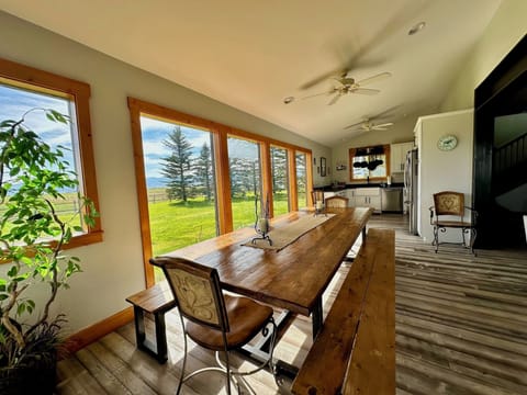 The dining area provides an extra large table with gorgeous views of tall pines and breathtaking mountains.