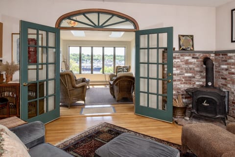 Enjoy the Gloucester harbor view from the Porch, Sunroom, Family Room & Kitchen.