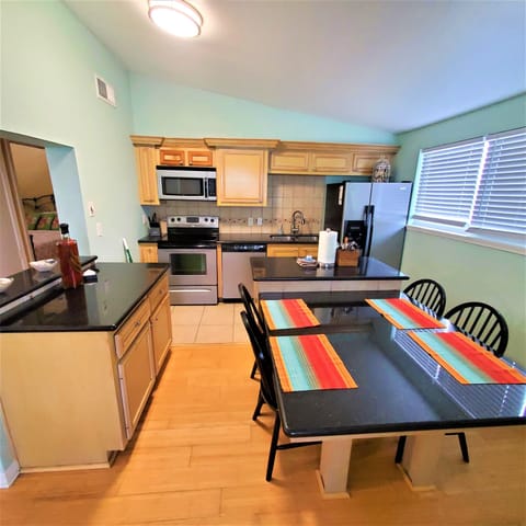kitchen with stainless steel fridge, oven/range, microwave etc.