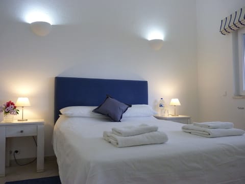 The master suite is clean and fresh with an ensuite bathroom