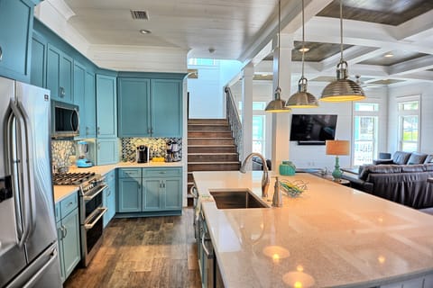 open kitchen to living area, 9X5 quartz island with bar stools, all the gadgets