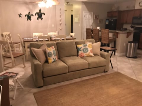 Great room with queen sofa sleeper and dining table and kitchen bar seating