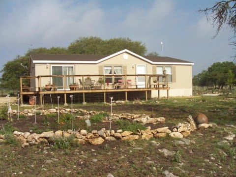 Front of the property in early spring. The gardens are not in full bloom yet