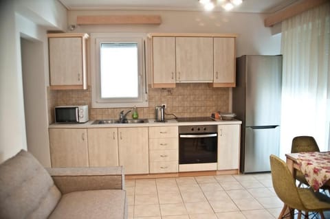 Superior Apartment, Multiple Beds, Garden View | Private kitchen | Full-size fridge, microwave, oven, stovetop