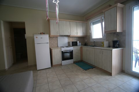Apartment, Balcony | Private kitchen | Full-size fridge, microwave, oven, stovetop