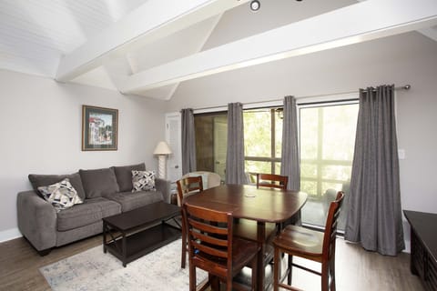 Beautiful cathedral ceiling makes this living space and kitchen airy and bright.