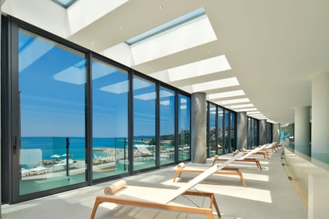 Indoor pool, seasonal outdoor pool, pool umbrellas, sun loungers