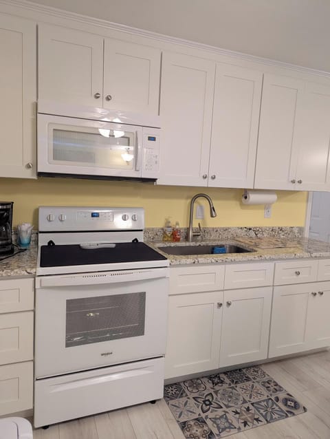 Brand new remodeled kitchen with soft close cabinets and granite counter-top.