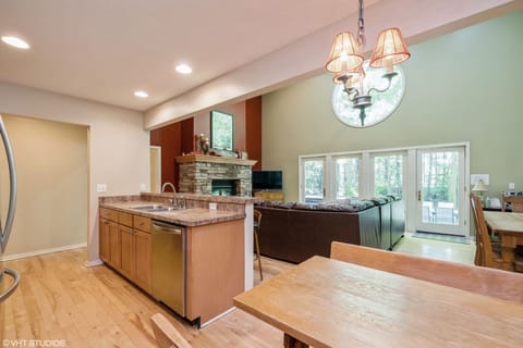 Kitchen island, bench seating leading out to great room