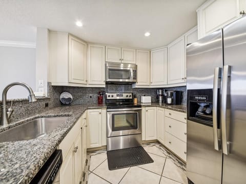 Kitchen with Stainless Steel Appliances at 1890 Beachside Tennis