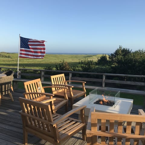 Relax by the fire pit with views over conservation and beach.